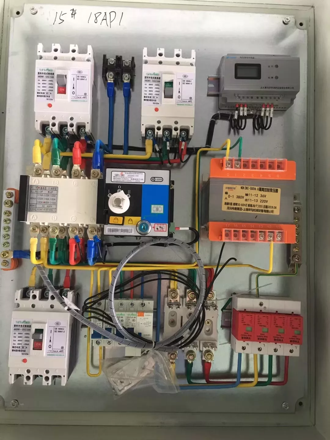 Three-phase industrial distribution panel with DIN rail SPD installed surge protection device