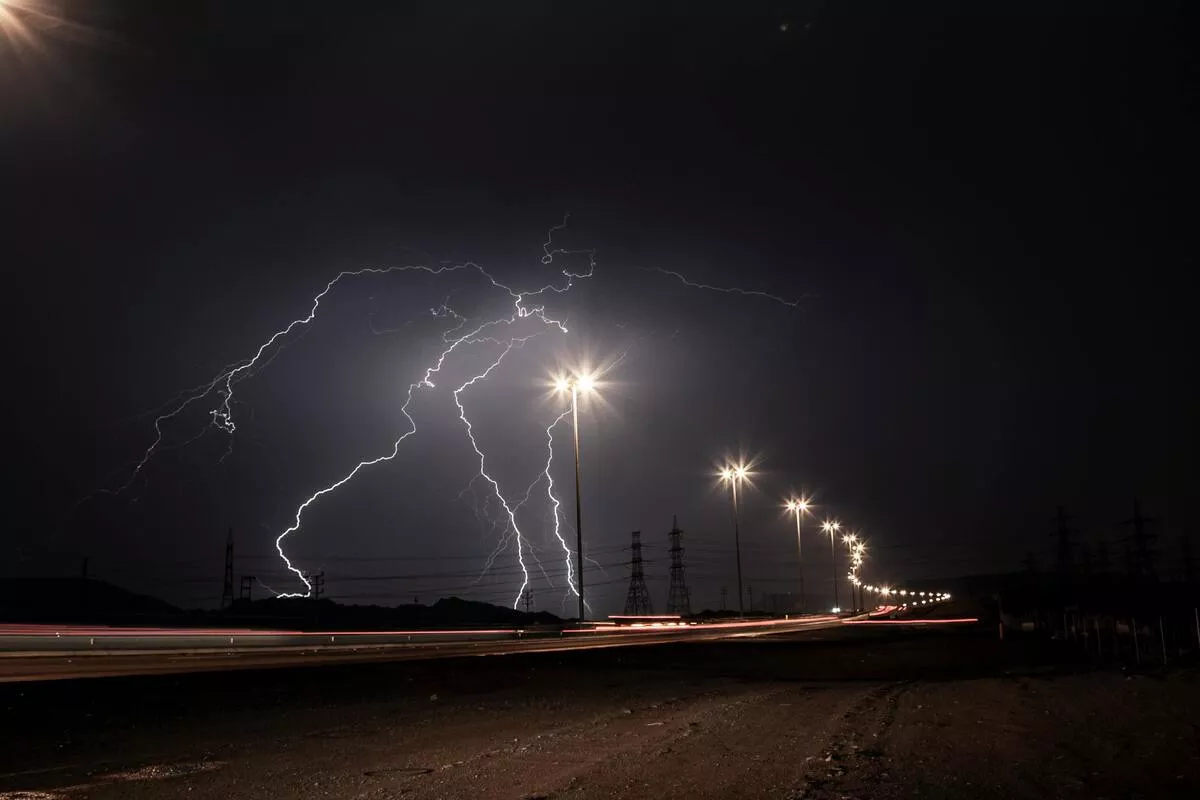 Lightning strike on overhead power lines causing transient overvoltage in distribution network