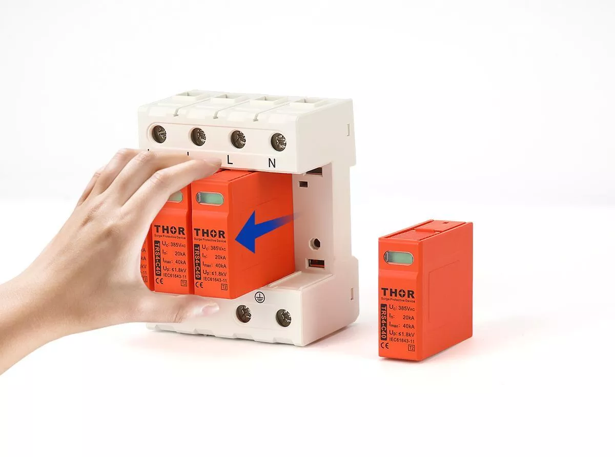 Thor TRS series pluggable SPD module being replaced from wiring base during surge protection device maintenance