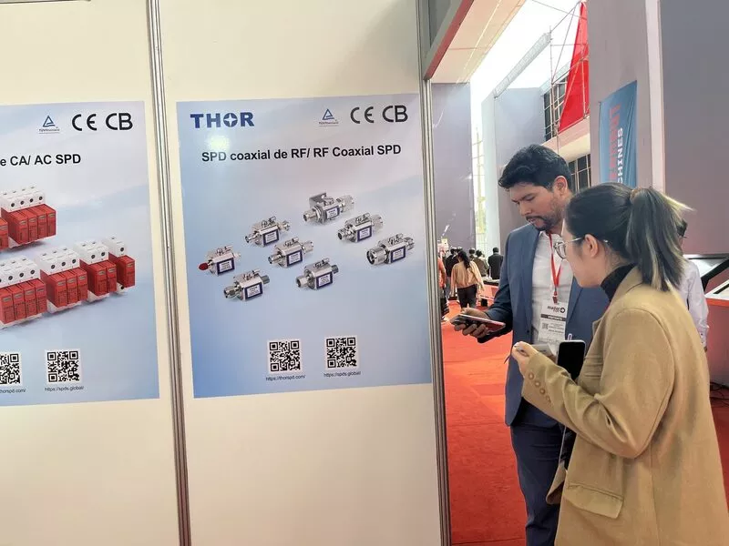 Visitors reading Thor AC and RF coaxial surge protection device boards at Expo Peru Industrial 2026